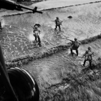 South Vietnamese troops wading through water in Vietnam